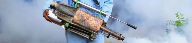 Fumigation technician using a fogger for deep pest treatment in Jackson, MS